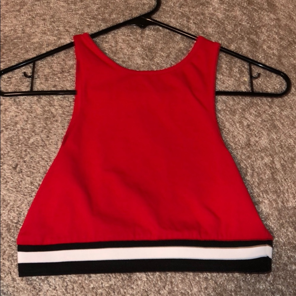 Red crop top with black and white stripe at bottom
